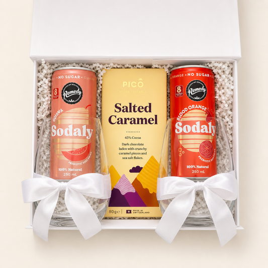 Gift set with two sodalys drinks and a chocolate bar in a box with a white bow.
