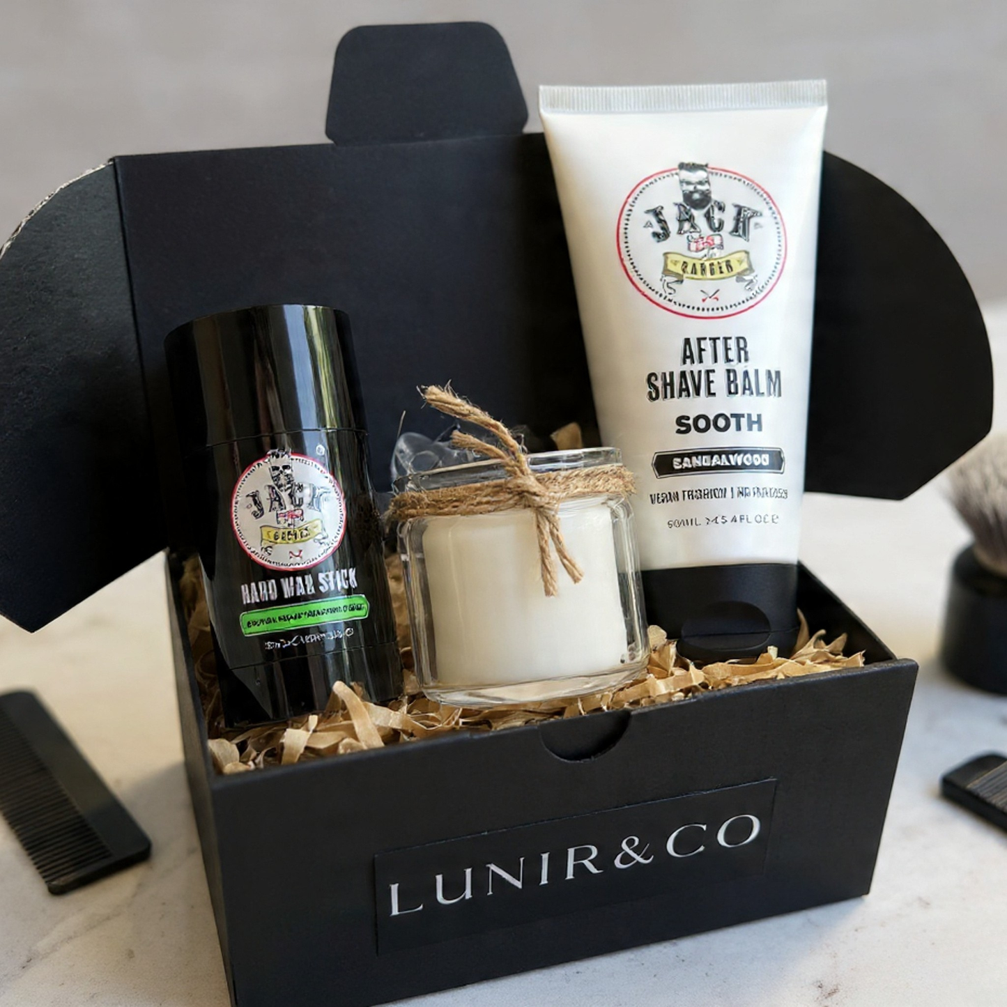 Barber & Co forming cream, Lunir & Co Black Ash soap, and a rope on a dark surface.