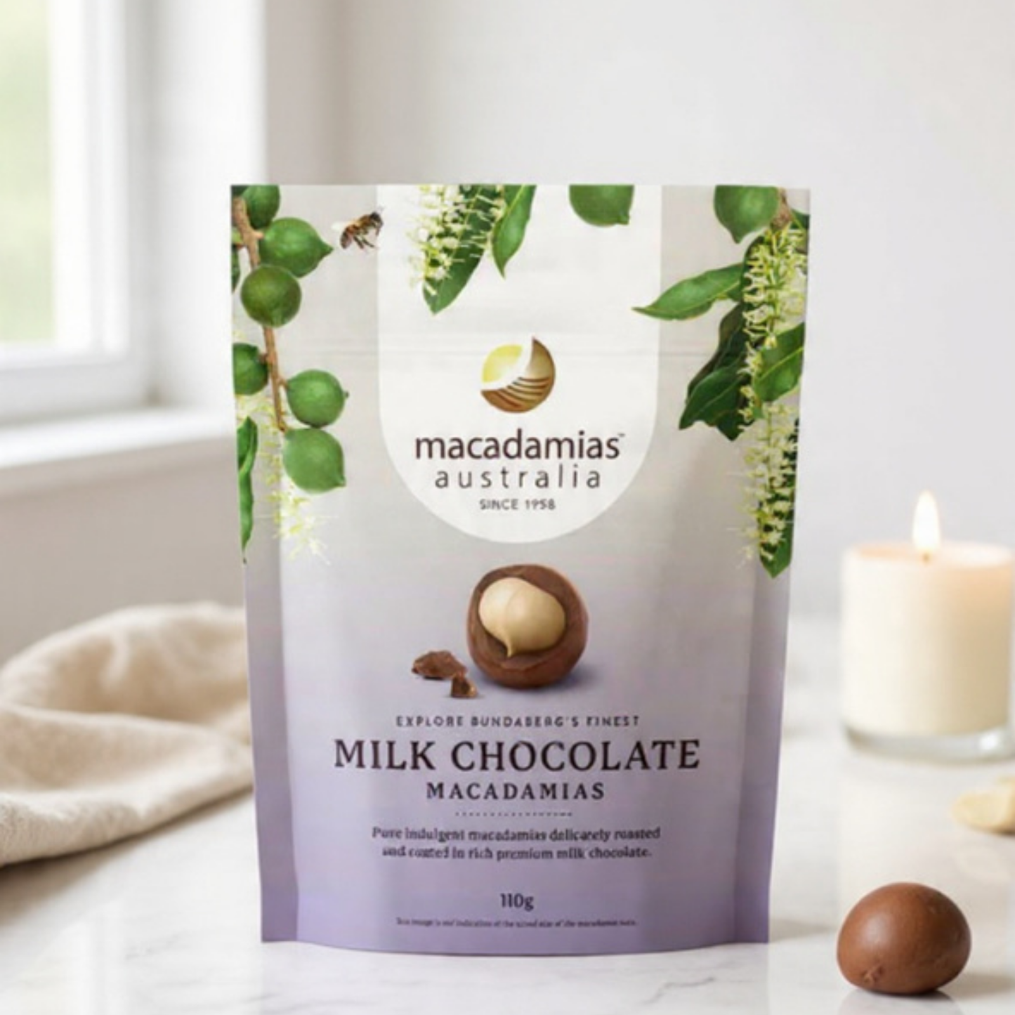Packaging of Macadamias Australia milk chocolate macadamias on a light background
