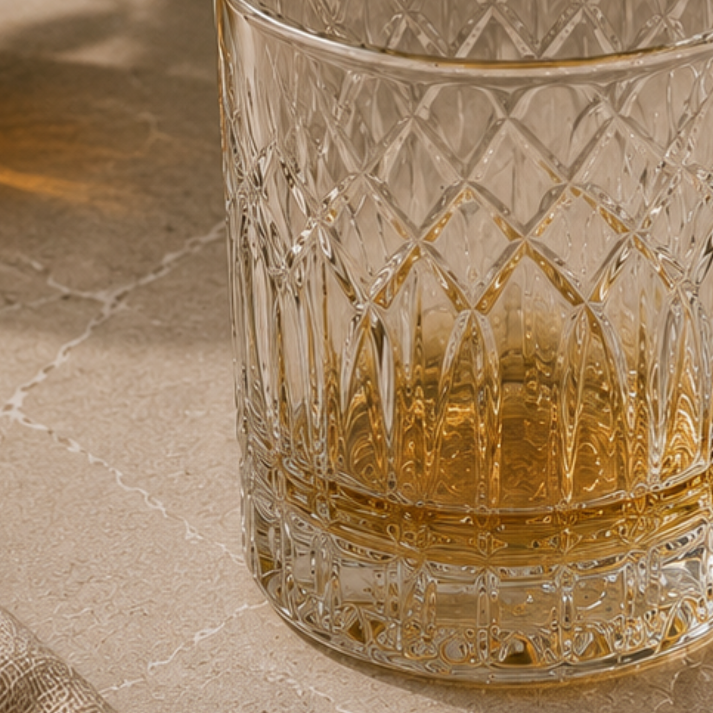 Decorative glass with intricate patterns on a marble surface