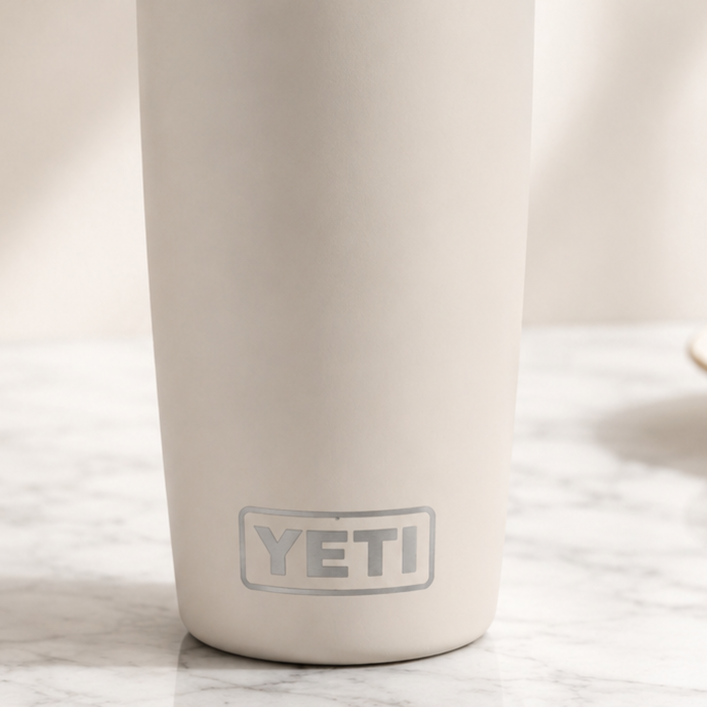 Beige YETI mug on a marble surface