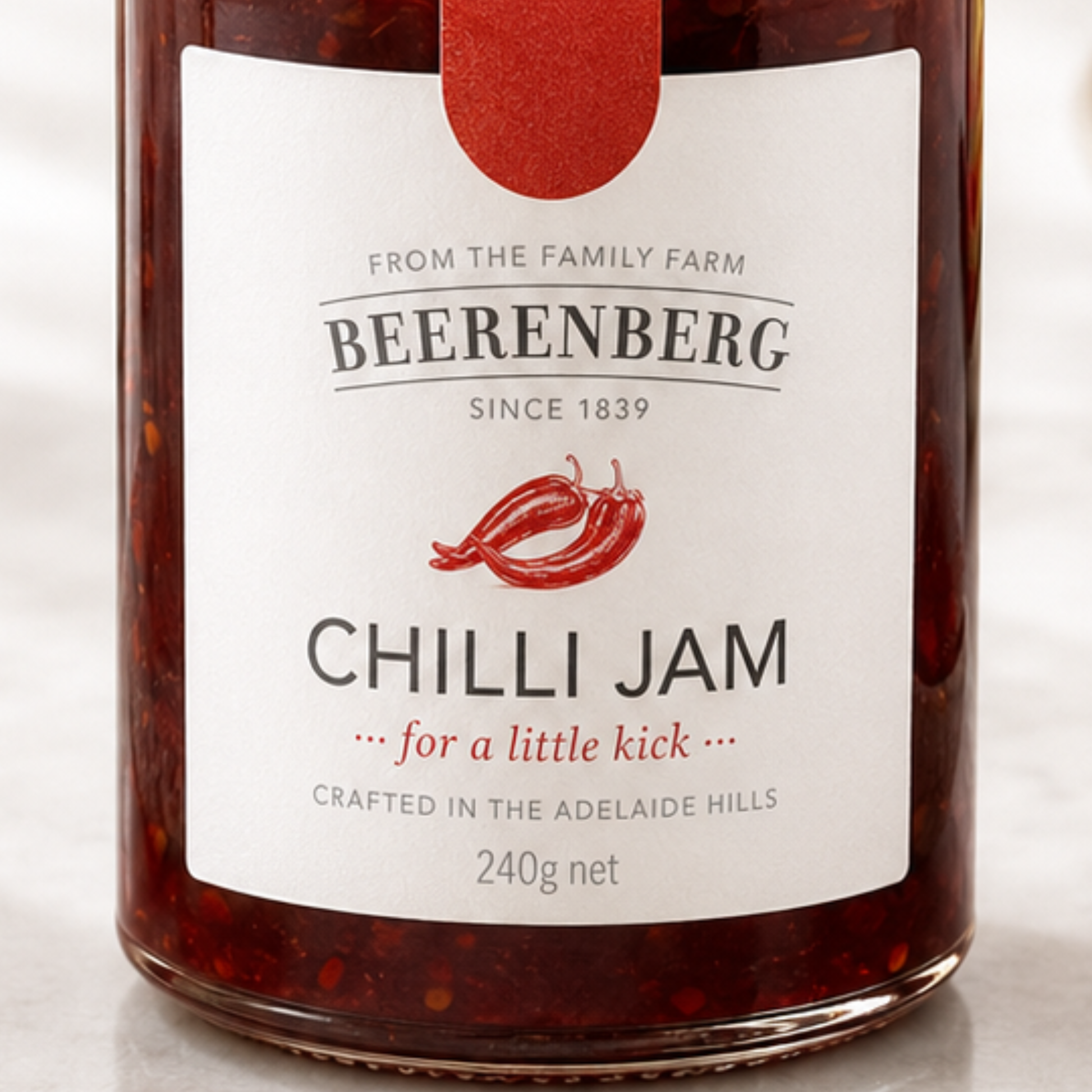 Jar of Beerenberg Chilli Jam with a red label on a white background