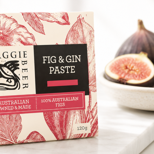 Box of Maggie Beer Fig & Gin Paste with figs in the background