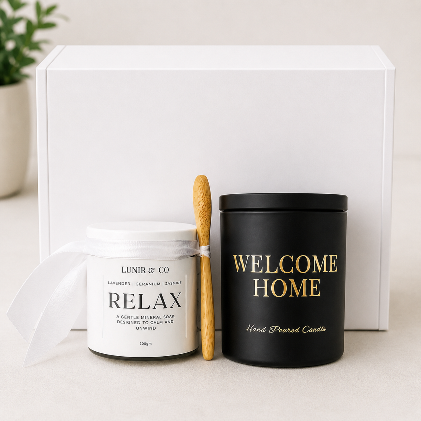 Candle and Bath soak in front of white box by Lunir and Co