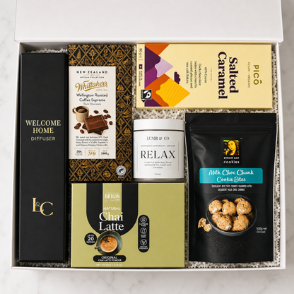 Gift set with coffee products, a diffuser, and cookies in a box.