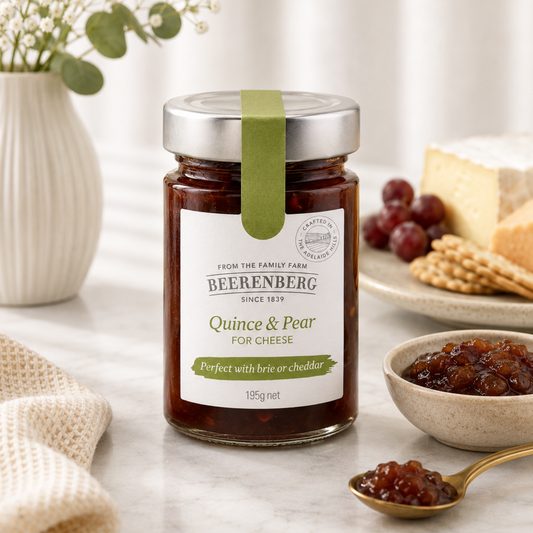 Jar of Beerenberg Quince & Pear for Cheese on a table with snacks