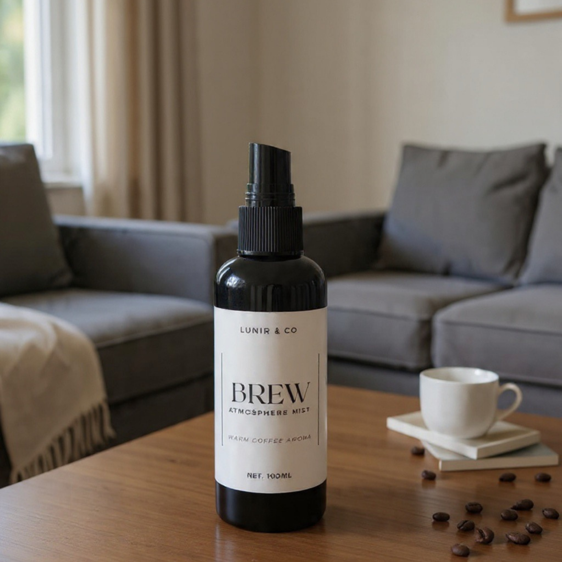 Bottle of 'Brew' atmosphere mist on a wooden table with a cup and coffee beans in a living room setting.