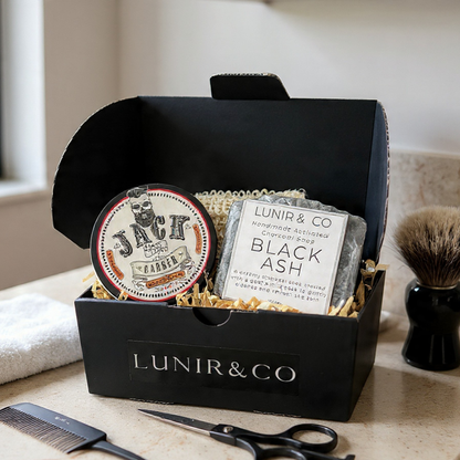 Grooming kit with products and tools in a black box labeled 'LUNIR & CO' on a wooden surface.