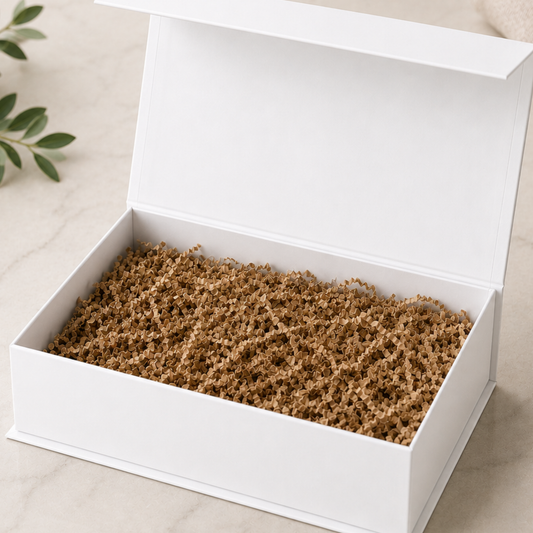 White box with brown material inside on a beige surface