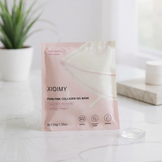 XIOIMY pink collagen gel mask packaging on a white surface with a plant in the background