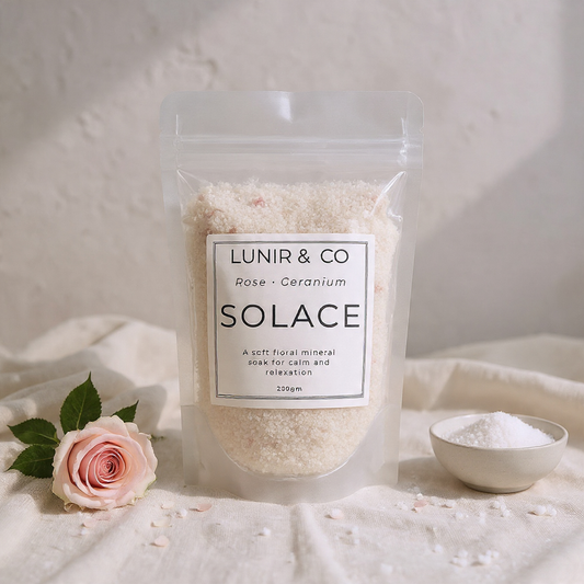 Packaged product labeled 'LUNIR & CO Solace' with a pink rose and small bowl of product on a light background