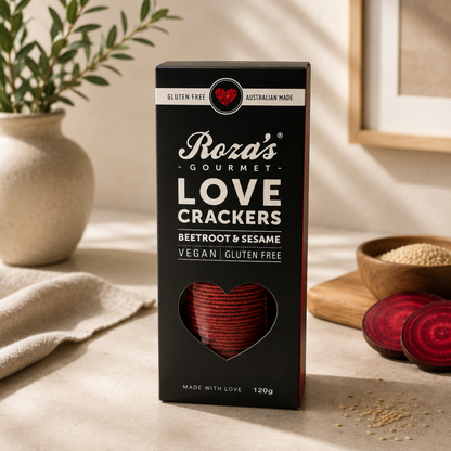 Box of Roza's Gourmet Love Crackers with heart design on a neutral background