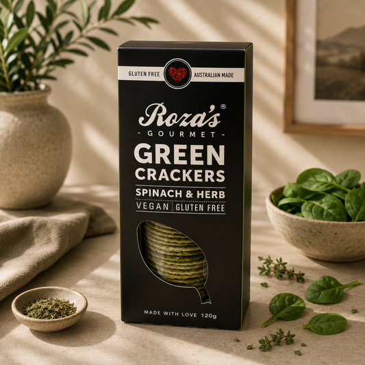Box of Roza's Gourmet Green Crackers with spinach and herb on a neutral background