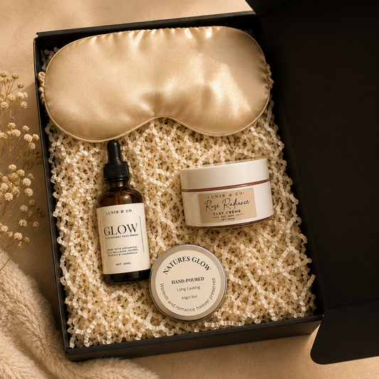 Skincare product set with eye mask, serum, and cream in a decorative box.