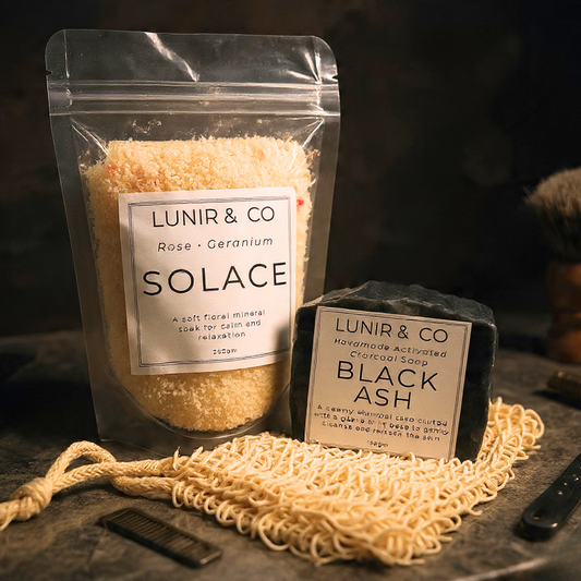 Solace Mineral bath salt and activated charcoal soap on a soap bag