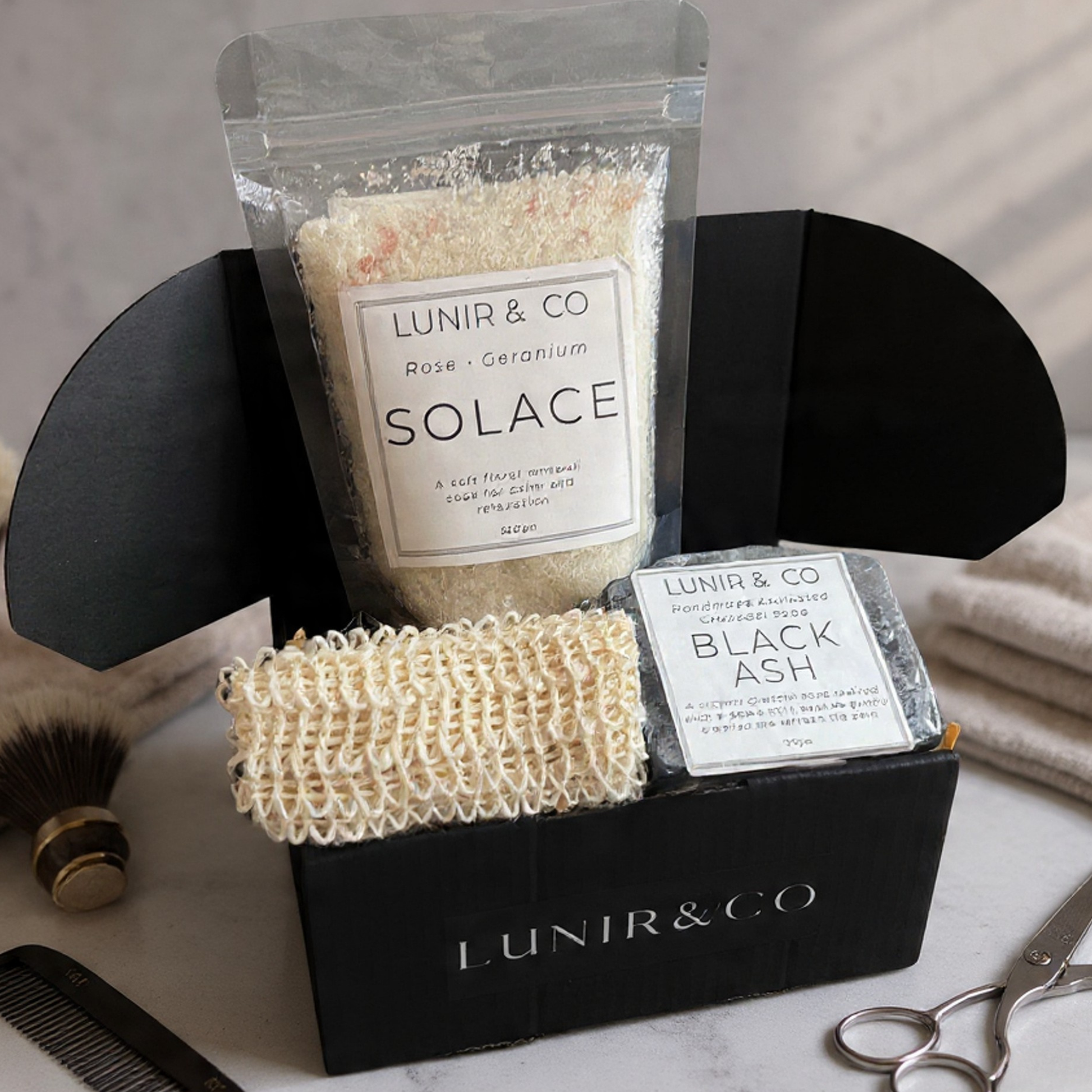 LUNIR & CO skincare products including a bag labeled 'Solace', a scrub, and a bar of soap on a marble surface.