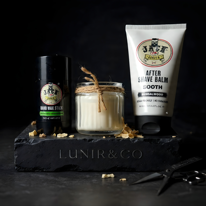 Grooming products including a candle, jar, and tube of aftershave balm on a dark surface with 'LUNIR&CO' branding.