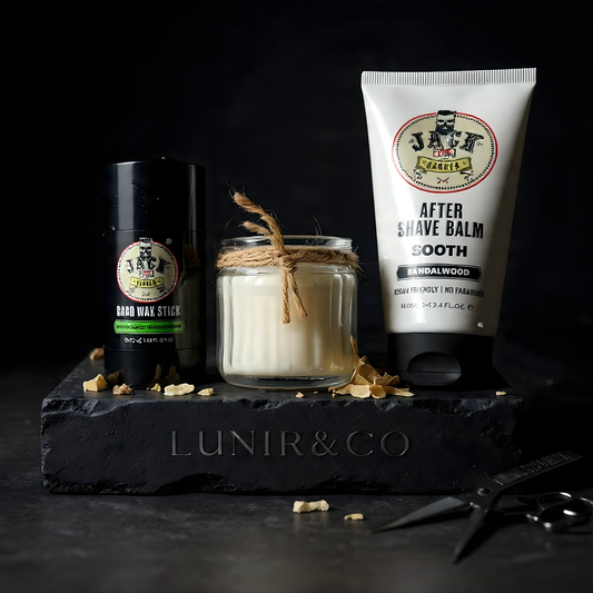 Grooming products including a candle, jar, and tube of aftershave balm on a dark surface with 'LUNIR&CO' branding.