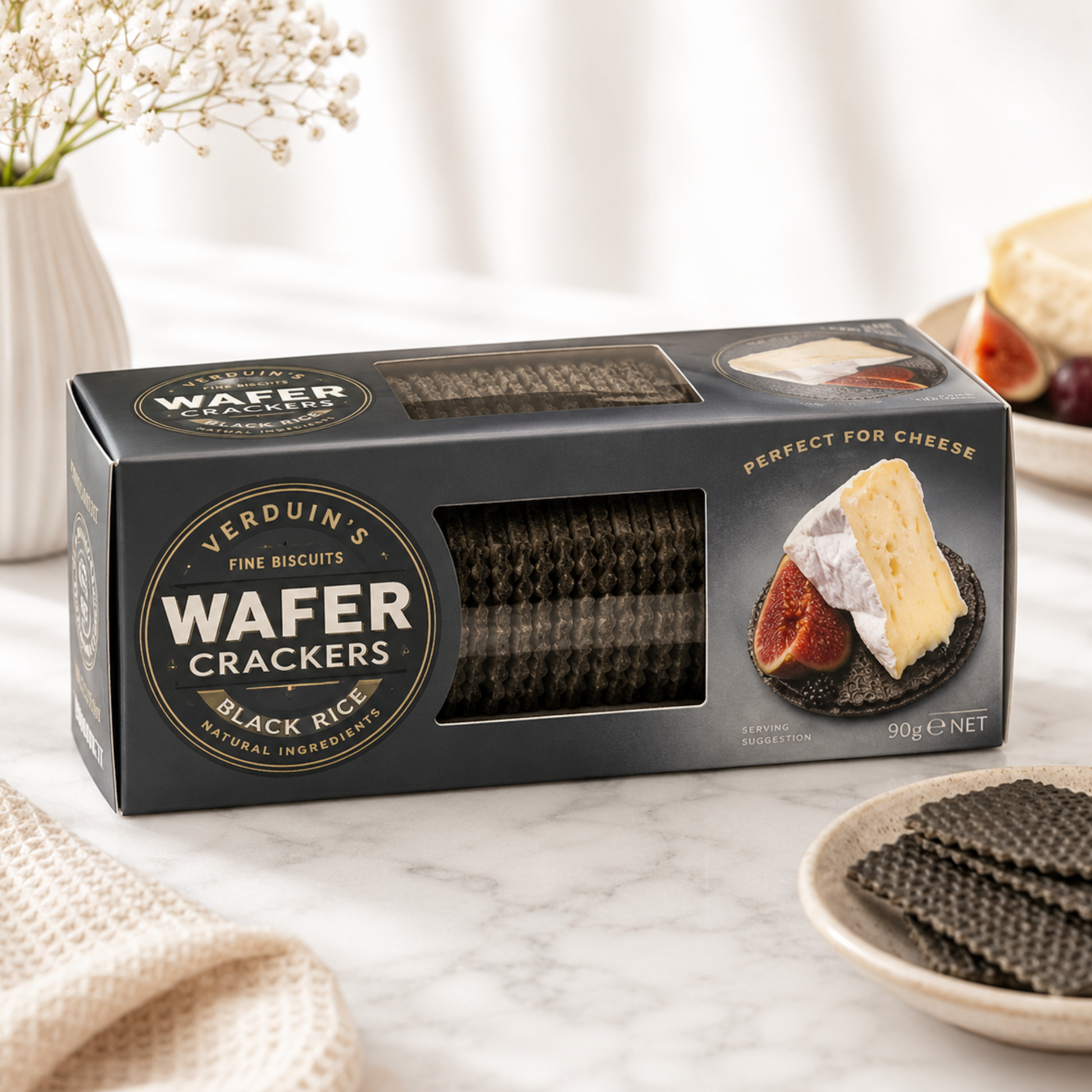 Box of Verduin's Wafer Crackers on a marble surface with crackers and cheese.