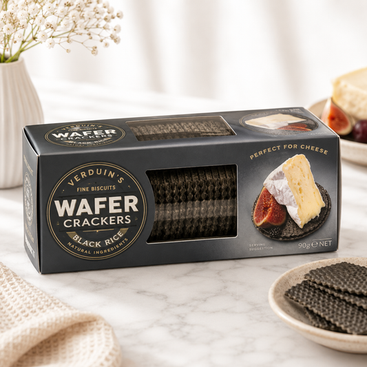 Box of Verduin's Wafer Crackers on a marble surface with crackers and cheese.