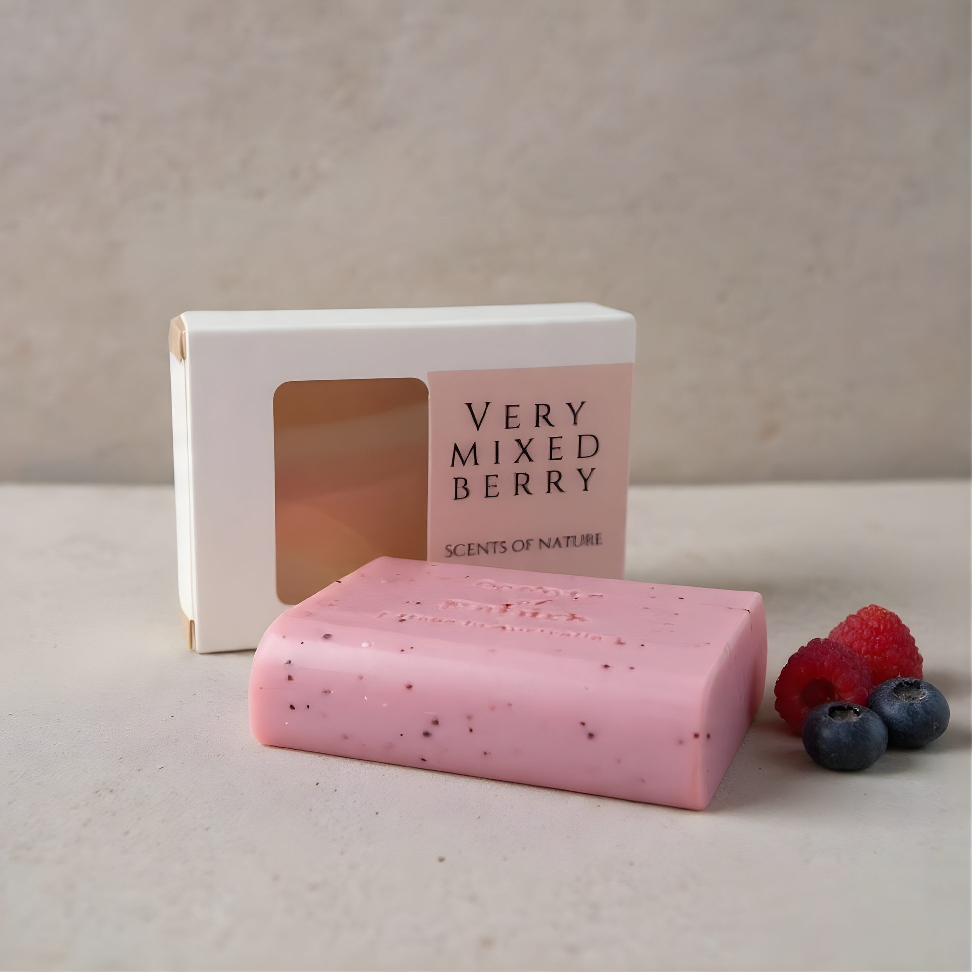 Pink soap bar with 'Very Mixed Berry' packaging and berries on a neutral background