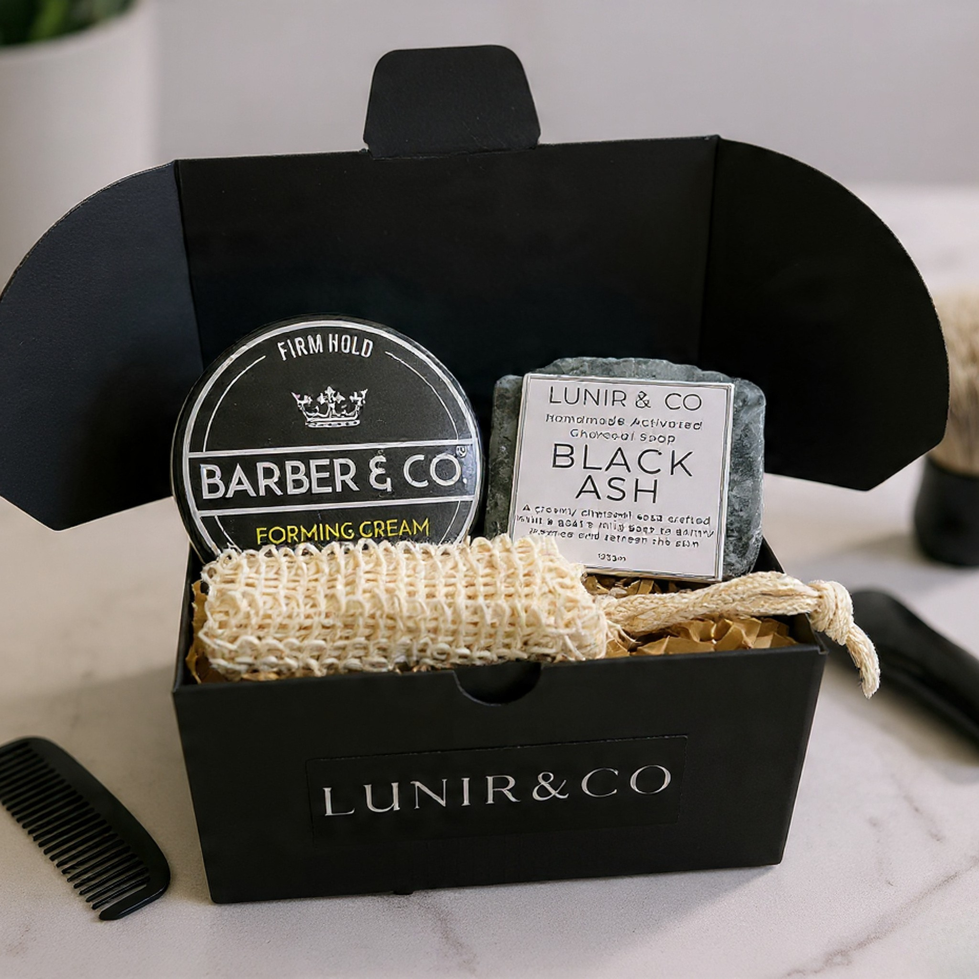 Grooming products including an after-shave balm, hard wax stick, and barbershop soap in a black box labeled 'LUNIR & CO'.