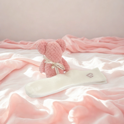 Jar of 'Cloud Mitt' scrub by Lunir & Co on a light surface with a vase of dried flowers in the background.