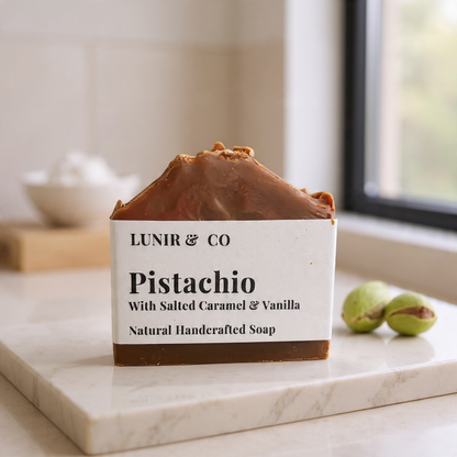 Handcrafted soap bar with 'LUNIR & CO' branding on a marble surface.